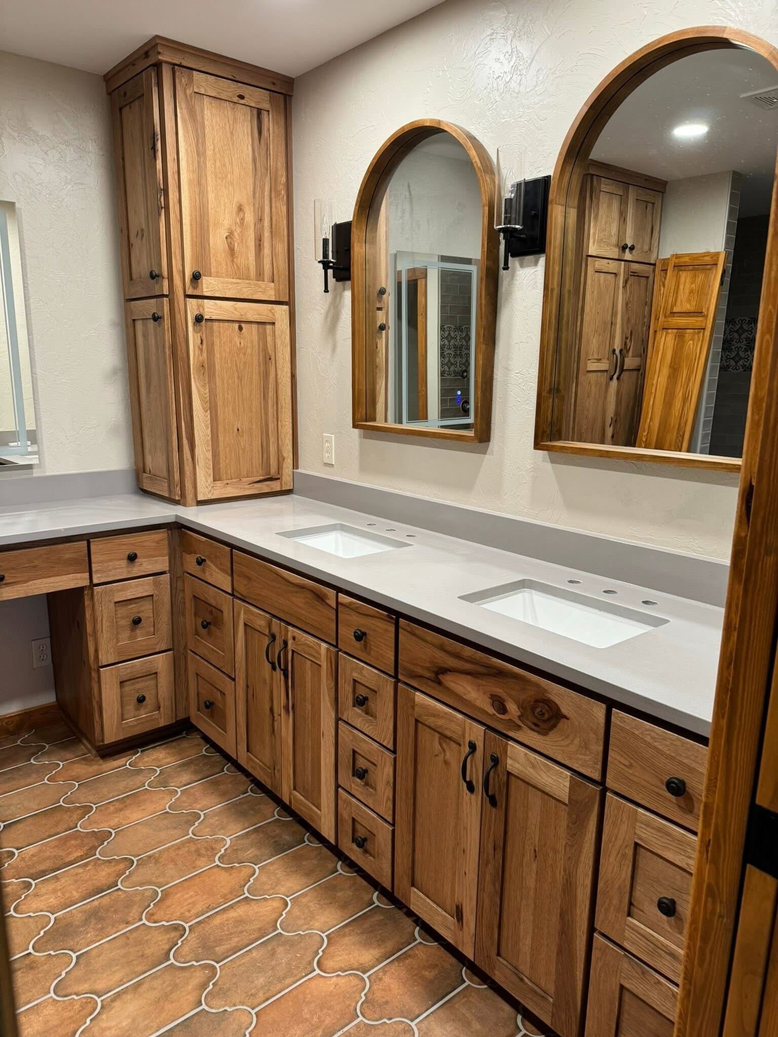 Rustic hickory bathroom vanity with arched mirrors